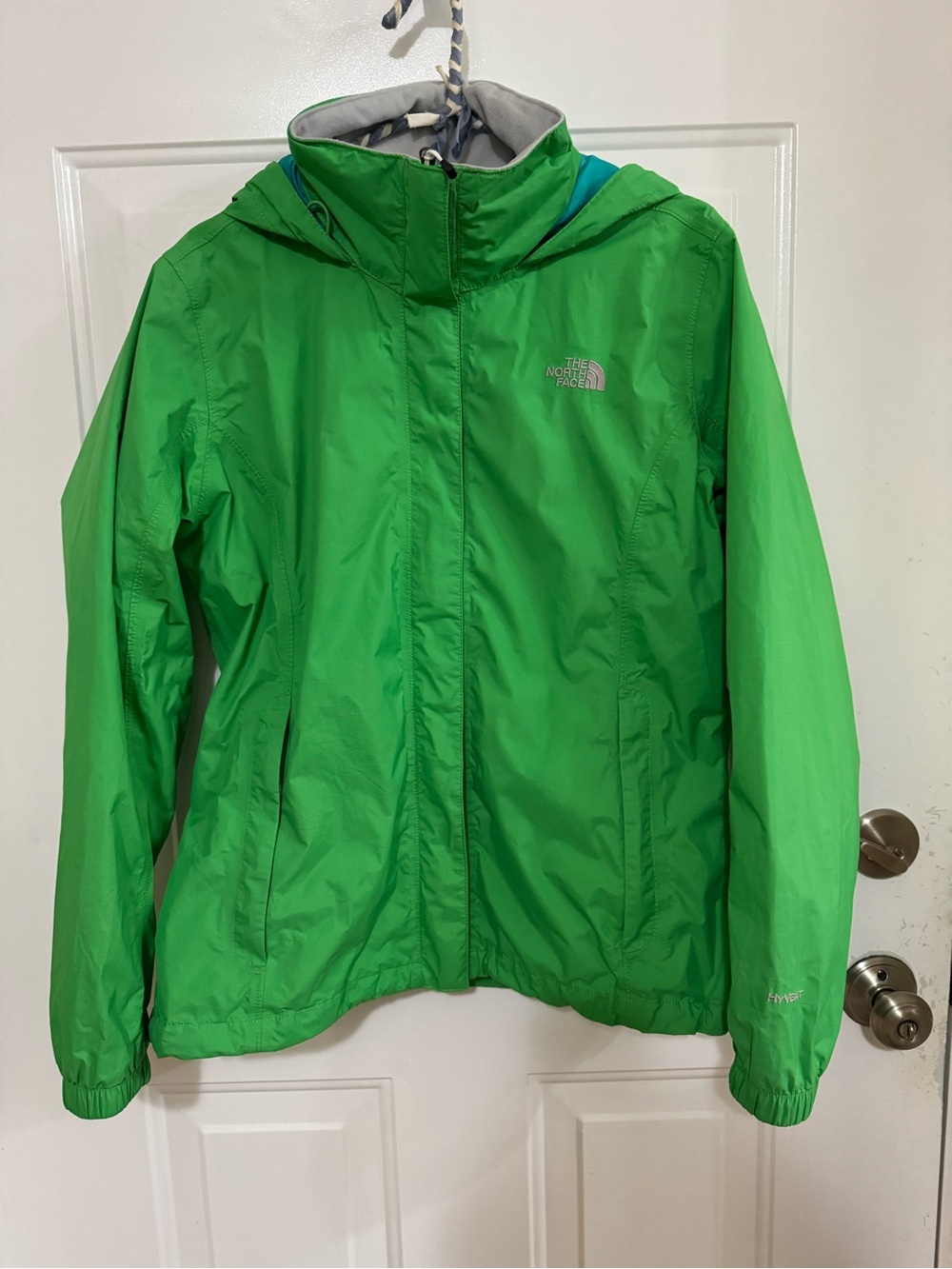 The North Face women’s Bright Green Hooded Rain Jacket